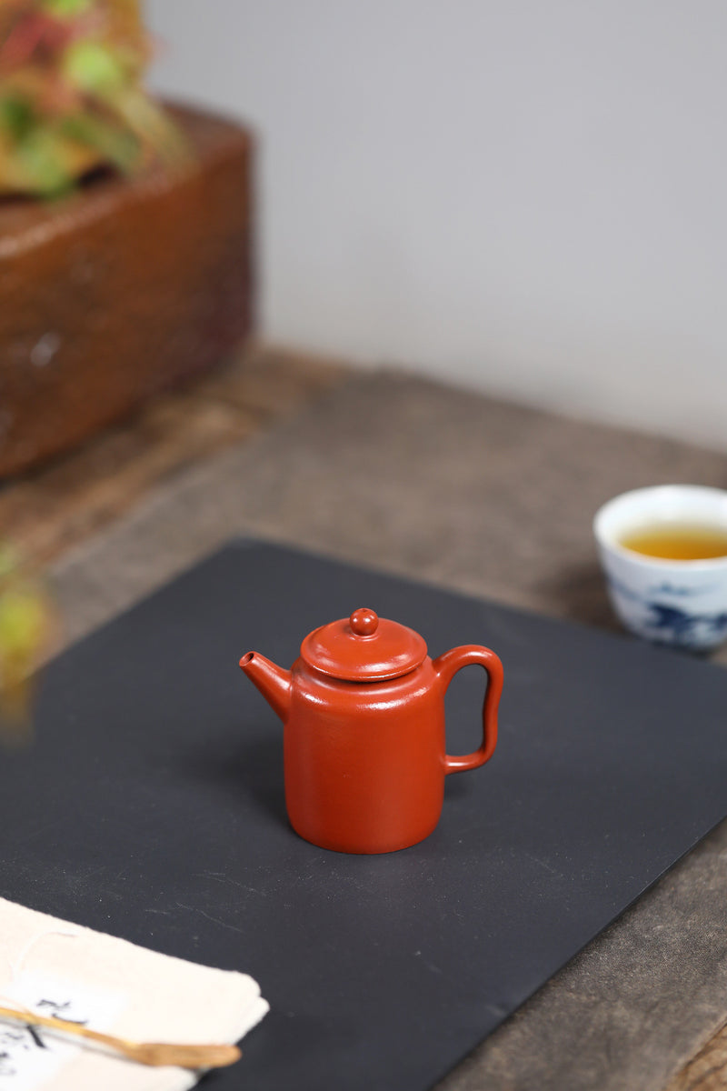 A small Kapu straight and wrinkled vermilion clay Yixing zisha pot with a Mengchen mark