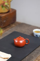 A small Xixi wrinkled skin vermilion clay Guangsu Mengchen-marked Yixing zisha pot