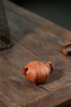 Yixing handmade purple clay pot wholesale bionic device downhill mud pumpkin 200ml