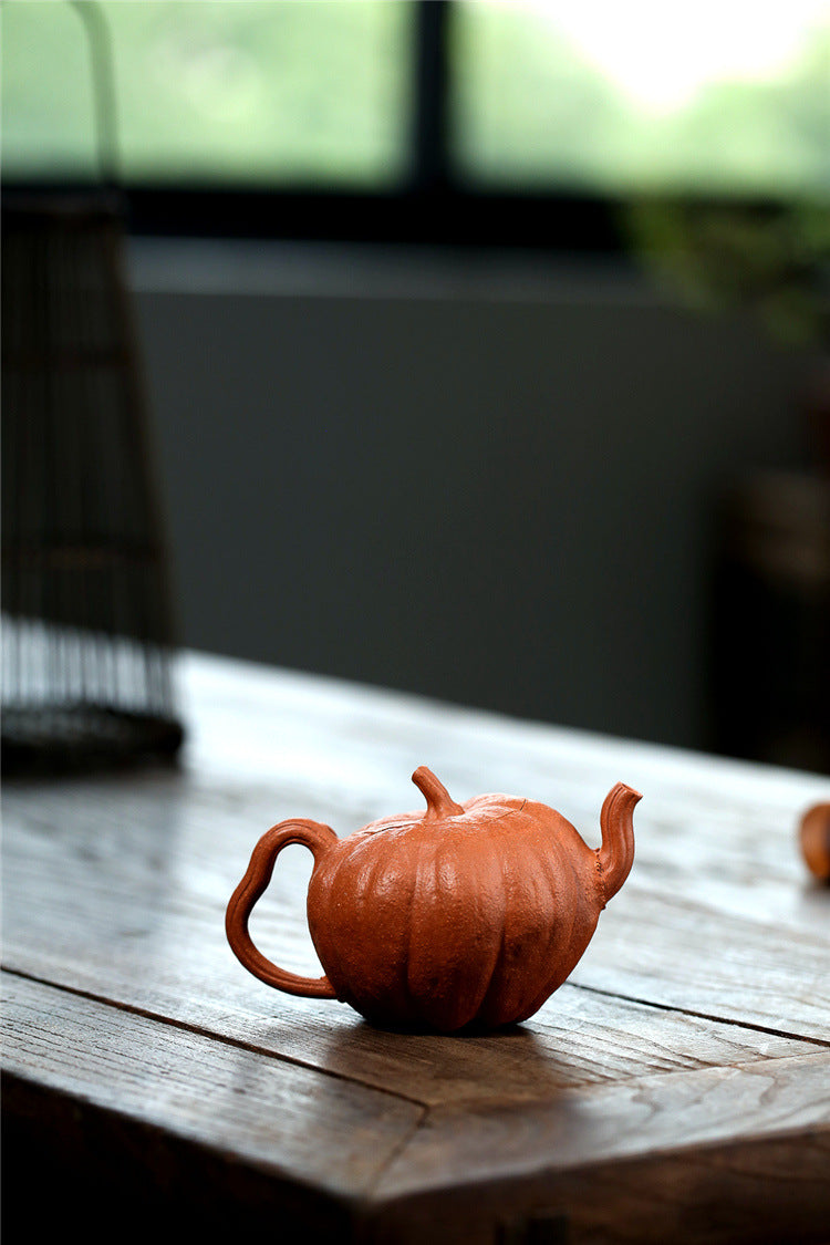 Yixing handmade purple clay pot wholesale bionic device downhill mud pumpkin 200ml