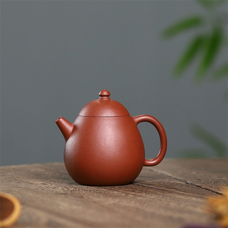 Yixing purple clay pot raw sand old vermilion mud handmade thin dragon egg 120ml