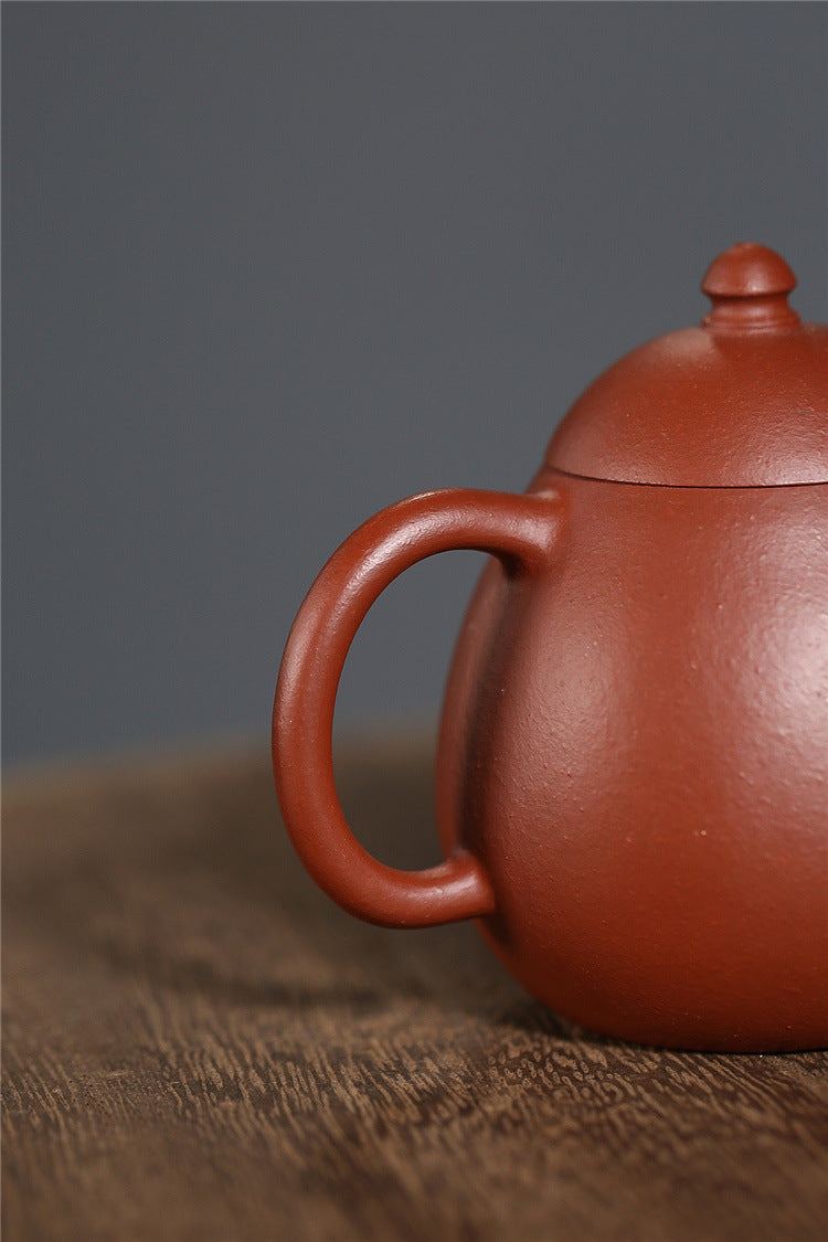 Yixing purple clay pot raw sand old vermilion mud handmade thin dragon egg 120ml